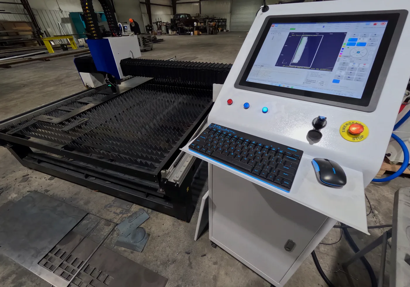 Laser cutting table and control station in a Kilroy shop setting